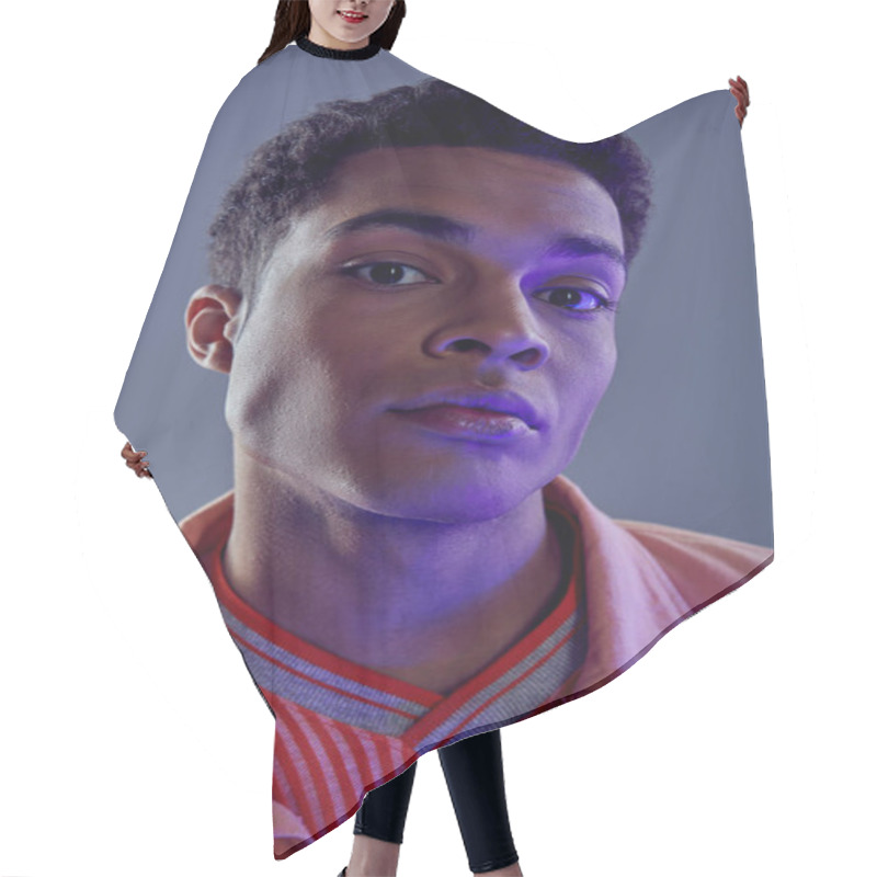 Personality  Portrait Of Handsome African American Man In Peach Shirt Looking At Camera On Grey With Blue Light Hair Cutting Cape