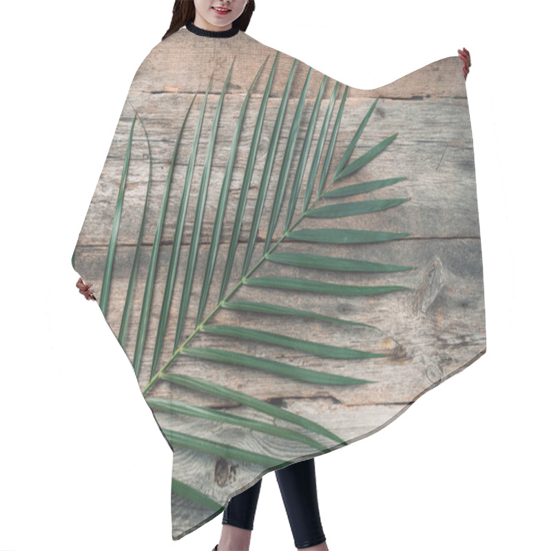 Personality  Green Tropical Palm Leaf On Wooden Planks Background. Exotic Branches Over Vintage Texture. Top View, Copy Space Hair Cutting Cape