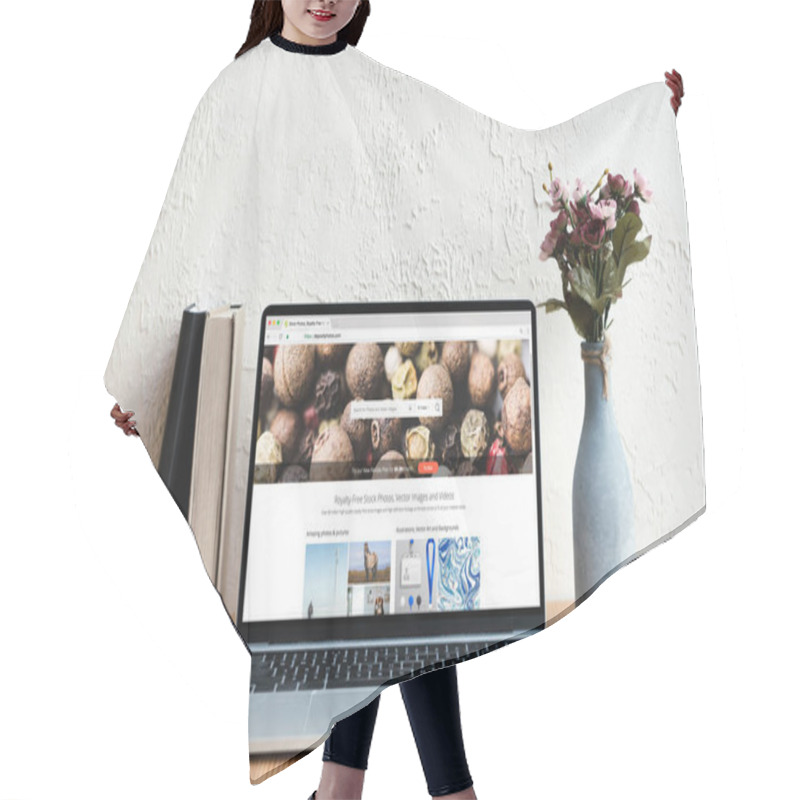 Personality  Laptop With Depositphotos Website On Screen, Books And Flowers In Vase On Wooden Table Hair Cutting Cape