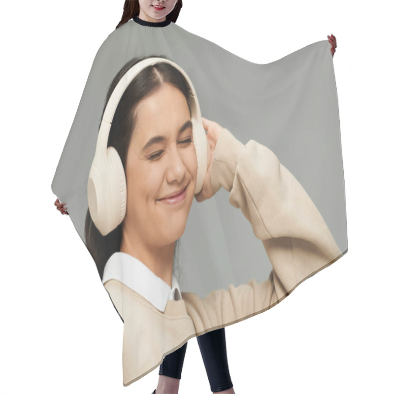 Personality  A Young Woman Experiences Bliss As She Enjoys Her Favorite Tunes In Fashionable Attire. Hair Cutting Cape