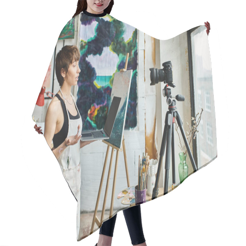 Personality  A Woman Standing In Front Of An Easel With A Painting. Hair Cutting Cape