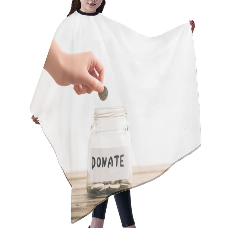 Personality  Cropped View Of Woman Putting Coin In Penny Jar With Donate Lettering On Wooden Surface On White Background Hair Cutting Cape