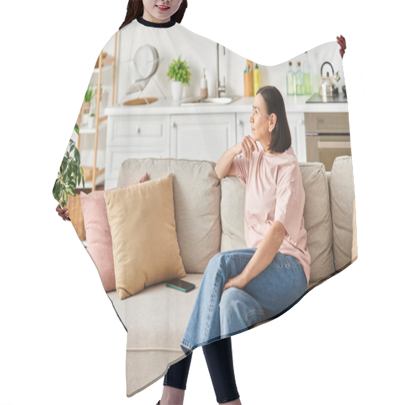 Personality  A Mature Woman Relaxes On A Couch In Her Cozy Living Room. Hair Cutting Cape