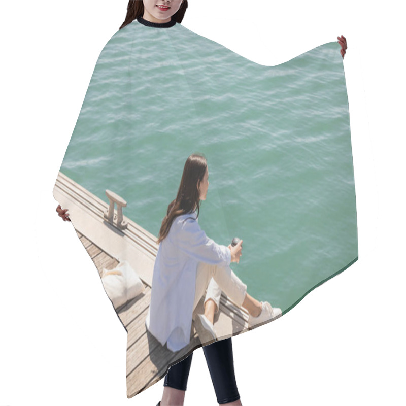 Personality  High Angle View Of Woman Sitting On Pier With Coffee To Go And Looking At Sea Hair Cutting Cape