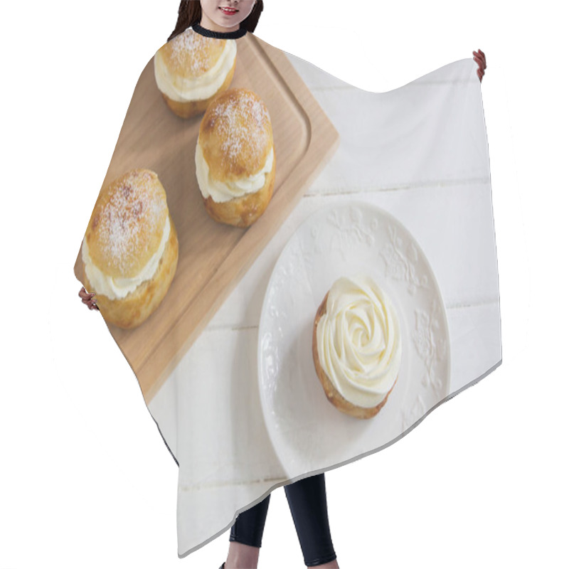 Personality  Fastelavn carnival buns sweet powder traditional nordic food. hair cutting cape