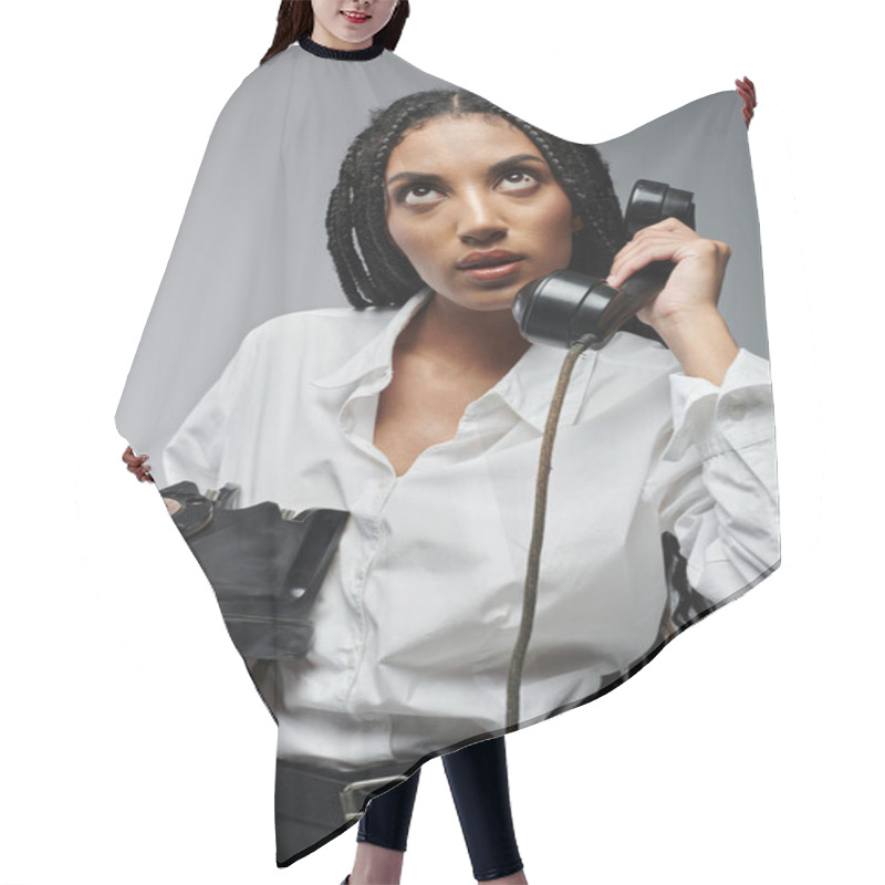 Personality  A Young Black Woman With Long Braids, Wearing A White Button-down Shirt And Black Pants, Speaks On An Old-fashioned Rotary Phone. Hair Cutting Cape