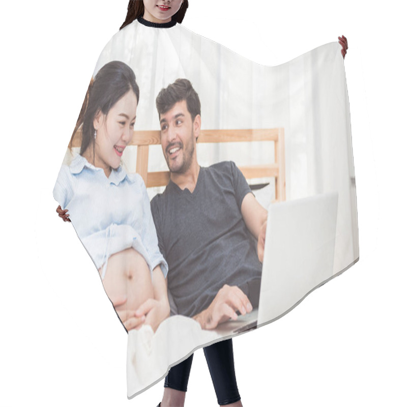 Personality  Happy Man And His Pregnant Wife Using Laptop To Searching Newborn Baby Items For Preparing Parenthood. Couple Lifestyle Family And Technology Concept. Women Health And Medical Theme. Hair Cutting Cape