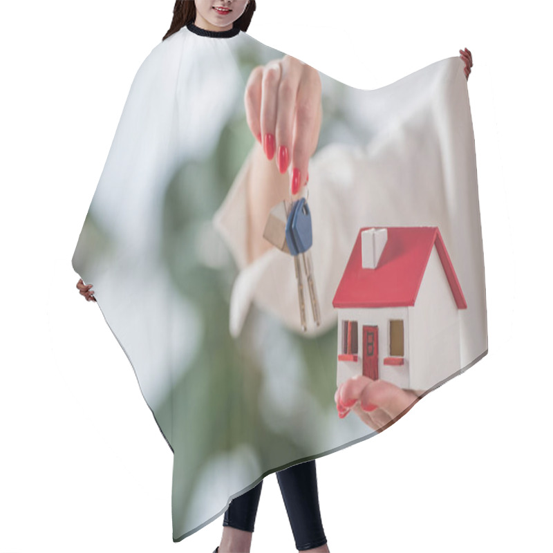 Personality  Partial View Of Businesswoman Showing House Model And Keys  Hair Cutting Cape