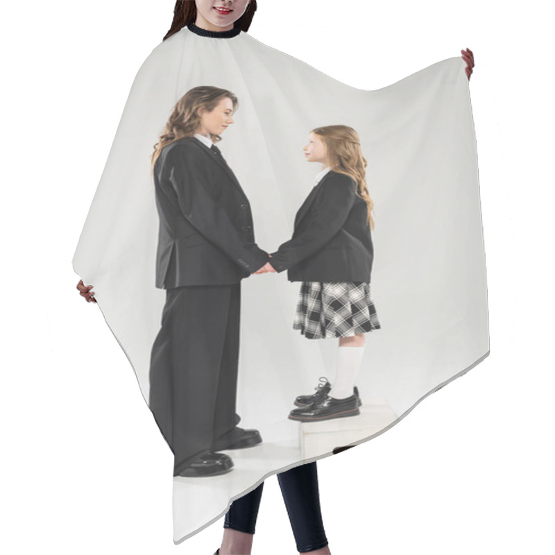 Personality  Mother And Child Holding Hands, Happy Woman In Business Attire And Child In School Uniform Standing On Step Stool On Grey Background, Modern Parenting, Face To Face Hair Cutting Cape