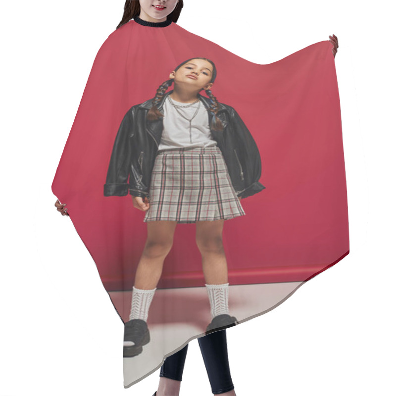 Personality  Full Length Of Confident And Fashionable Preteen Girl With Hairstyle Wearing Leather Jacket And Plaid Skirt While Standing And Posing On Red Background, Stylish Preteen Outfit Concept Hair Cutting Cape