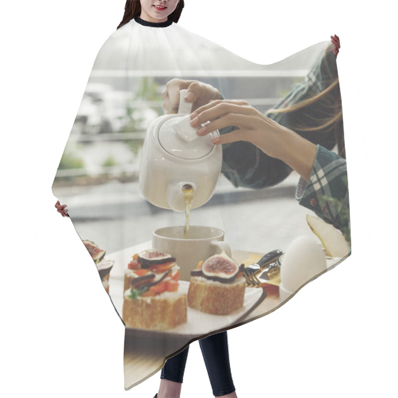 Personality  Cropped Shot Of Girl Pouring Tea From Teapot While Having Breakfast   Hair Cutting Cape