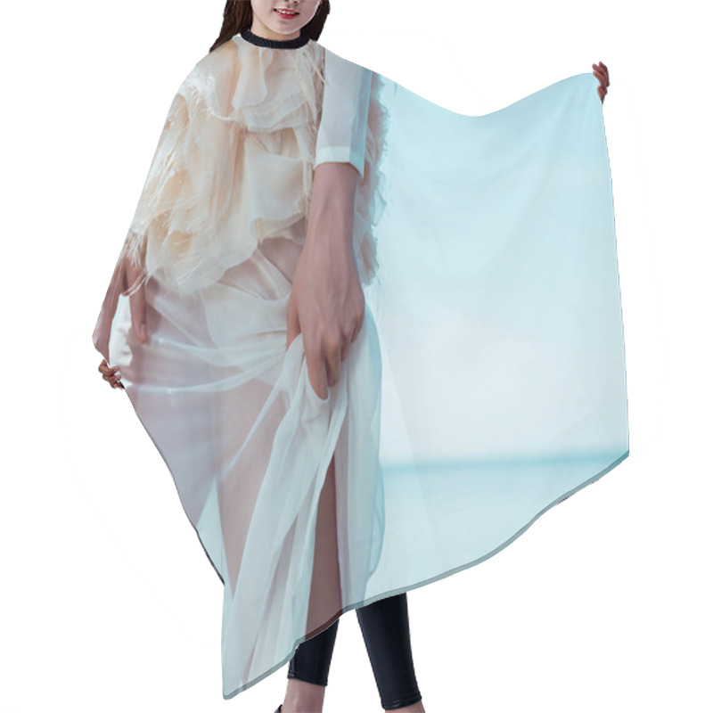 Personality  Cropped View Of Adult Woman In White Swan Costume Standing On Blue Sky Background Hair Cutting Cape