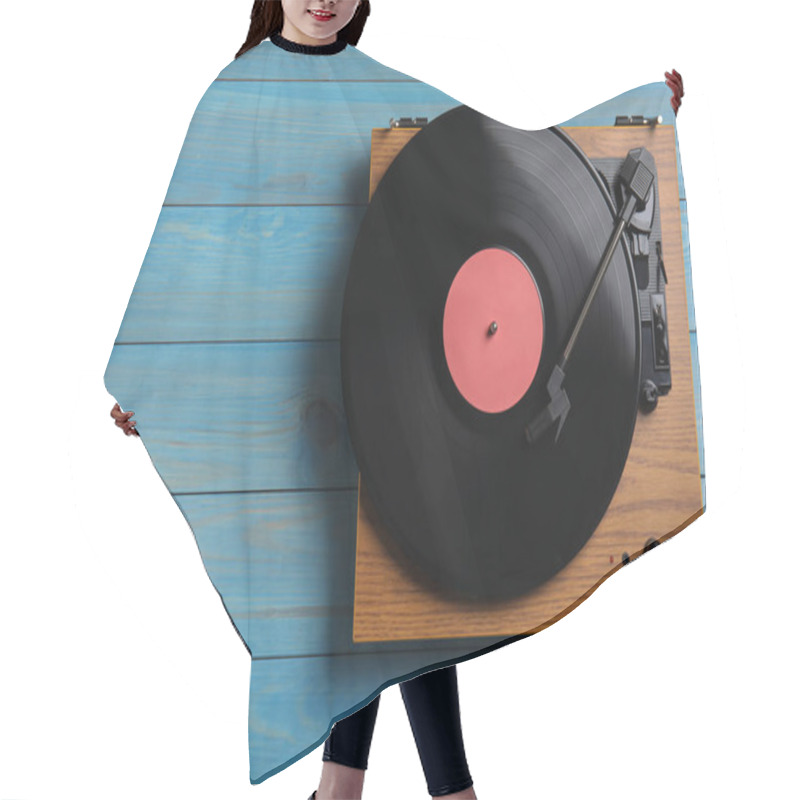 Personality  Modern Vinyl Record Player With Disc On Blue Wooden Background, Top View. Space For Text Hair Cutting Cape