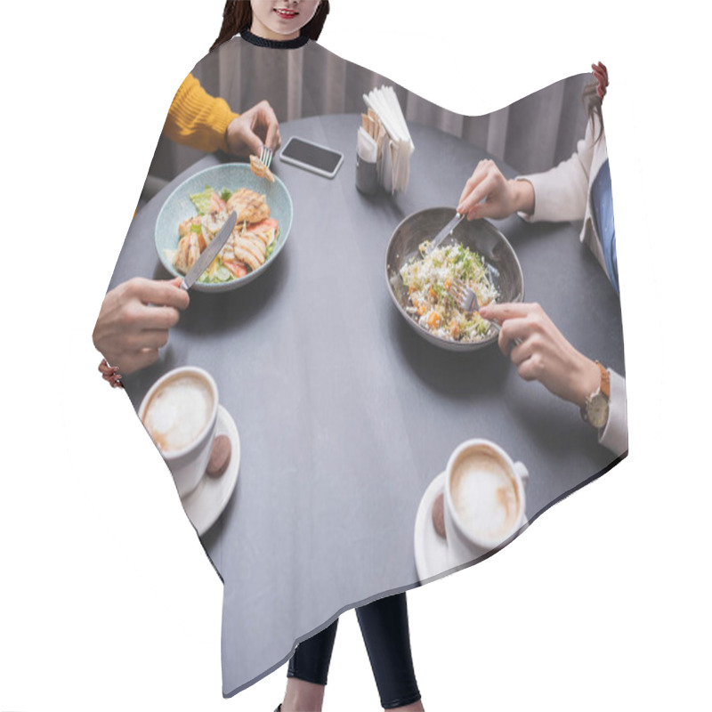 Personality  Cropped View Of Couple Dinning With Salads Near Cappuccino On Blurred Foreground In Restaurant  Hair Cutting Cape