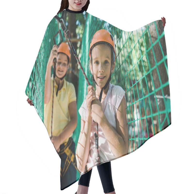 Personality  Selective Focus Of Happy Kids In Helmets With Height Equipment In Adventure Park  Hair Cutting Cape