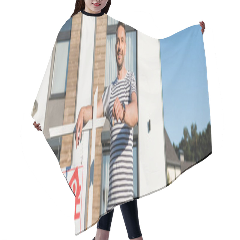 Personality  Smiling Man Looking At Camera While Showing Key Near Sign With Sold Lettering With Modern House On Background, Banner Hair Cutting Cape