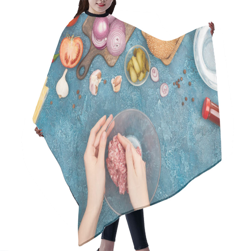 Personality  Top View Of Woman Holding Bawl With Raw Minced Meat Near Fresh Burger Ingredients On Blue Textured Surface Hair Cutting Cape