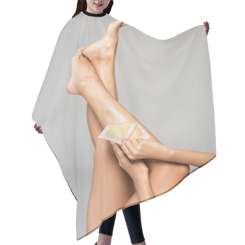 Personality  Cropped View Of Woman Removing Wax Stripe On Leg Isolated On Grey  Hair Cutting Cape