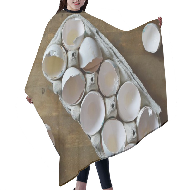 Personality  A Carton Box Of Empty Egg Shells On A Wooden Background  Hair Cutting Cape