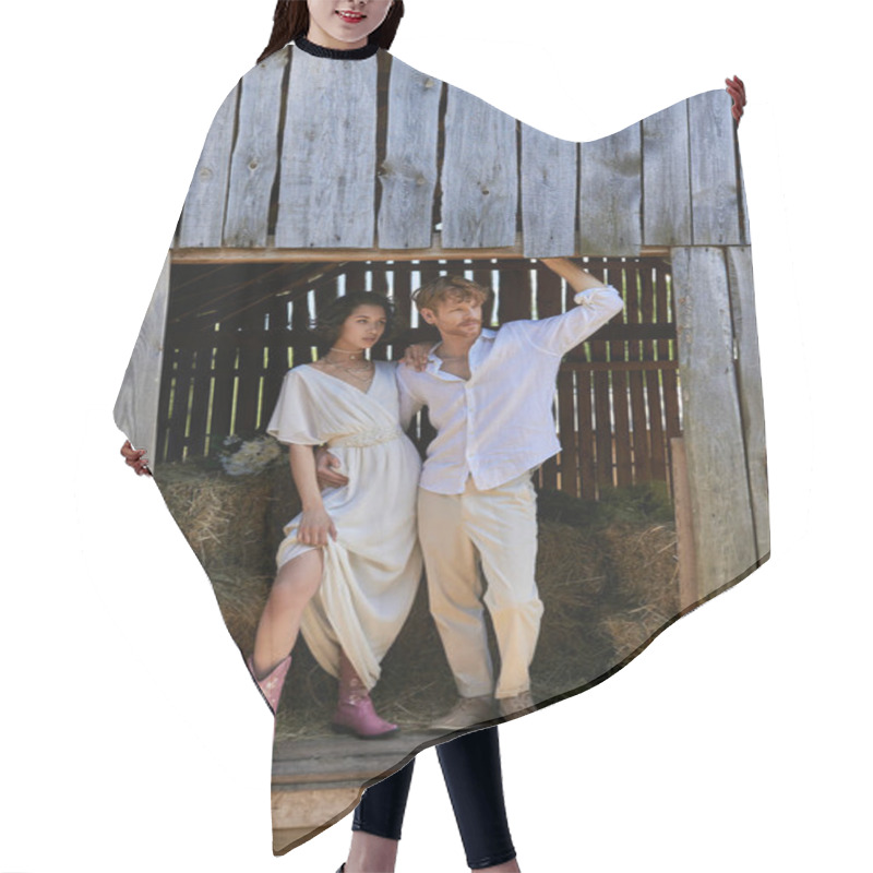 Personality  Newlyweds In Countryside, Asian Bride In Cowboy Boots And White Dress Standing With Groom In Barn Hair Cutting Cape