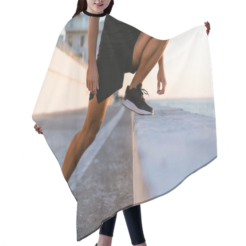 Personality  Cropped Shot Of Sportsman Stretching Before Training On Seashore Hair Cutting Cape