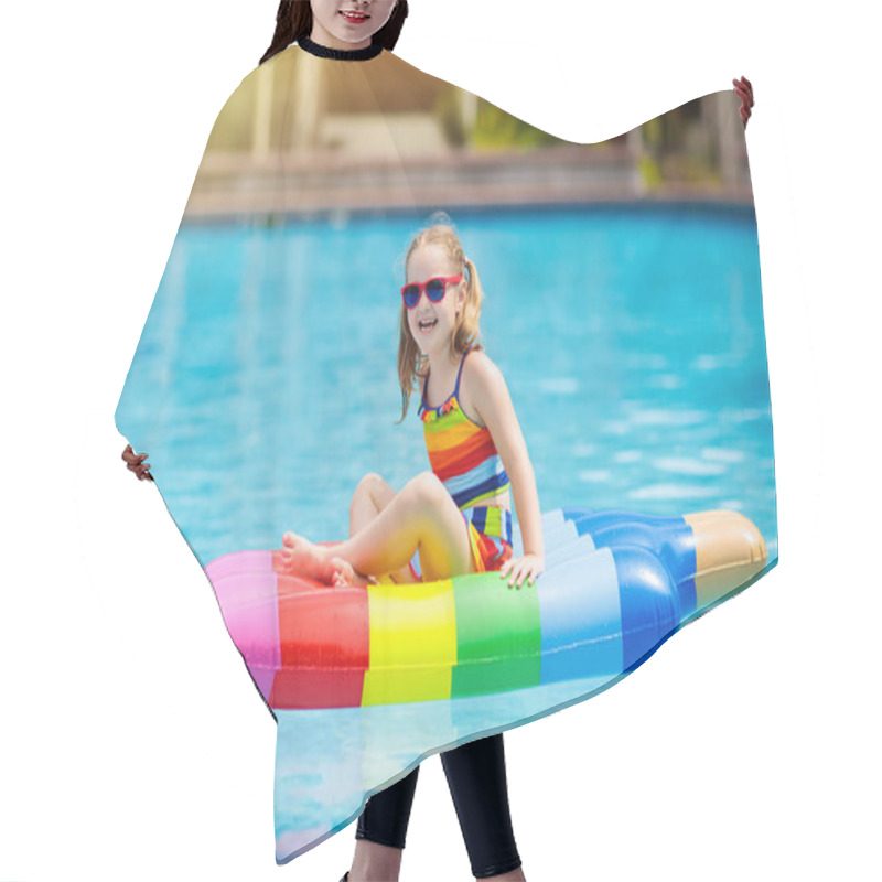 Personality  Child On Inflatable Float In Swimming Pool.  Hair Cutting Cape