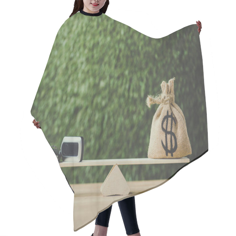 Personality  Money Bag With Dollar Sign And Car Key Balancing On Seesaw On Green Background Hair Cutting Cape