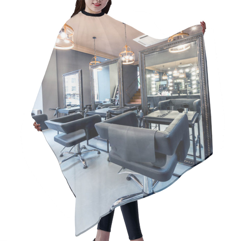 Personality  Modern Designer Interior Of A Beauty Salon With Mirrors, Lamps, Armchairs, Cosmetics Hair Cutting Cape