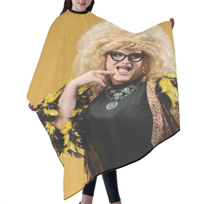 Personality  A Queer Person In Stylish Attire Poses With A Sassy Expression Against A Yellow Backdrop. Hair Cutting Cape