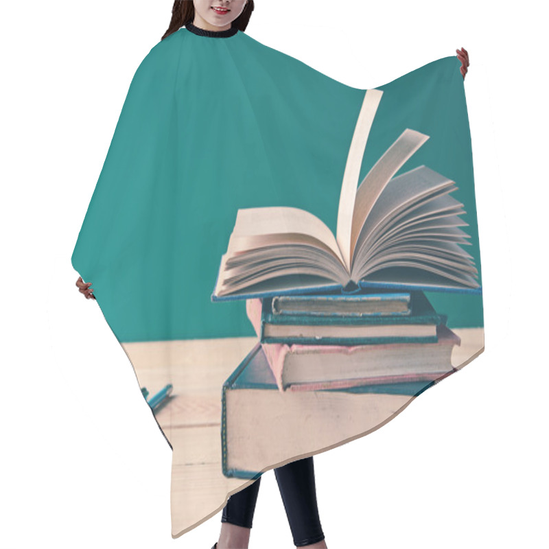 Personality  A Pile Of Books On Wooden Table Hair Cutting Cape