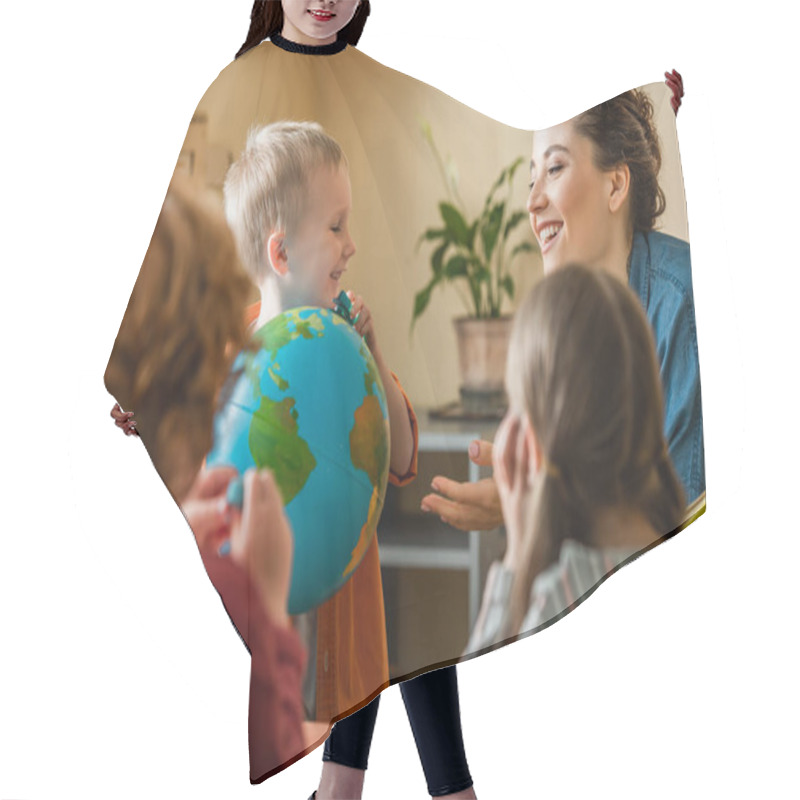 Personality  Happy Boy Holding Globe Near Cheerful Teacher An Kids On Blurred Foerground Hair Cutting Cape