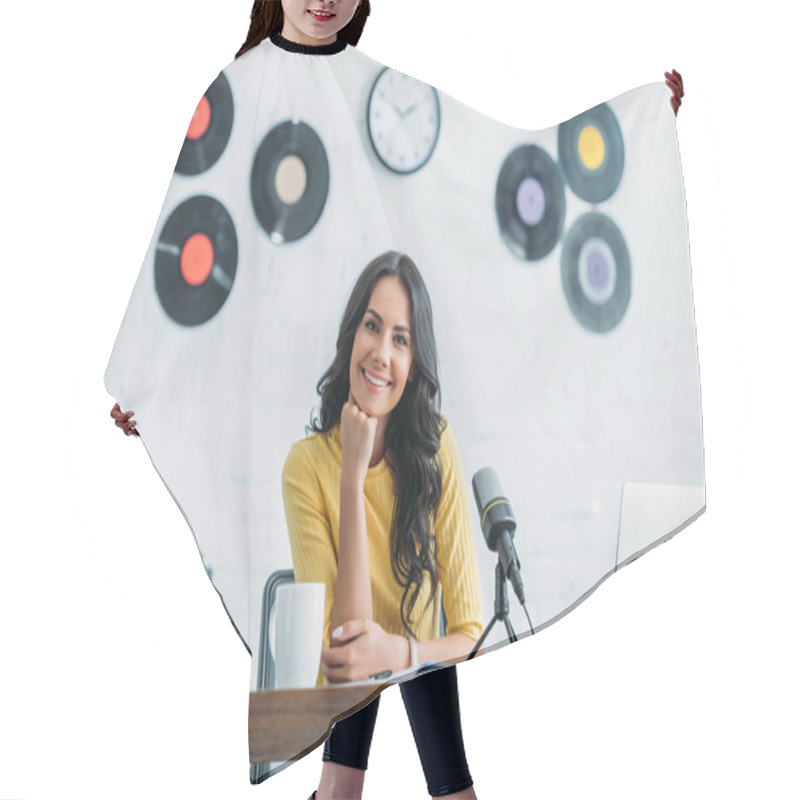 Personality  Attractive Radio Host Smiling At Camera While Sitting At Workplace In Radio Studio Hair Cutting Cape