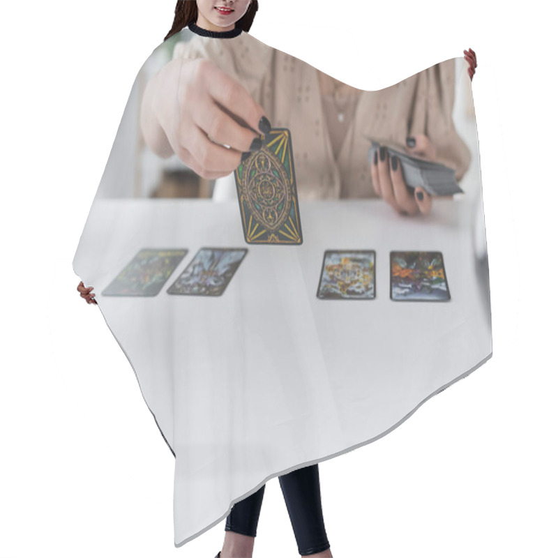 Personality  KYIV, UKRAINE - FEBRUARY 23, 2022: Cropped View Of Blurred Medium Holding Tarot Cards At Home  Hair Cutting Cape