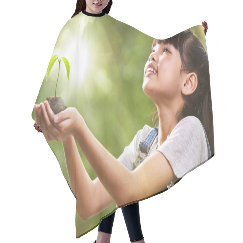 Personality  A Girl Holding A Young Plant In Her Hands With A Hope Of Good Environment Hair Cutting Cape