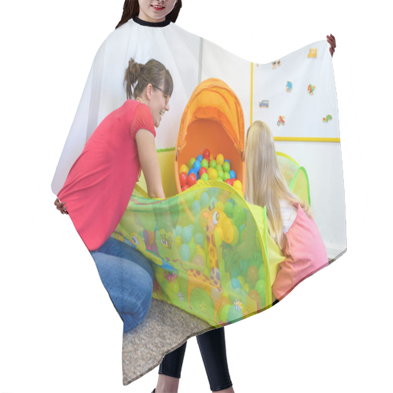 Personality  Toddler Girl In Child Occupational Therapy Session Doing Playful Exercises With Her Therapist. Hair Cutting Cape