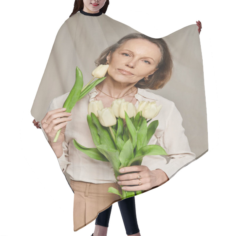 Personality  Mature Woman Joyfully Holding A Bouquet Of White Tulips. Hair Cutting Cape