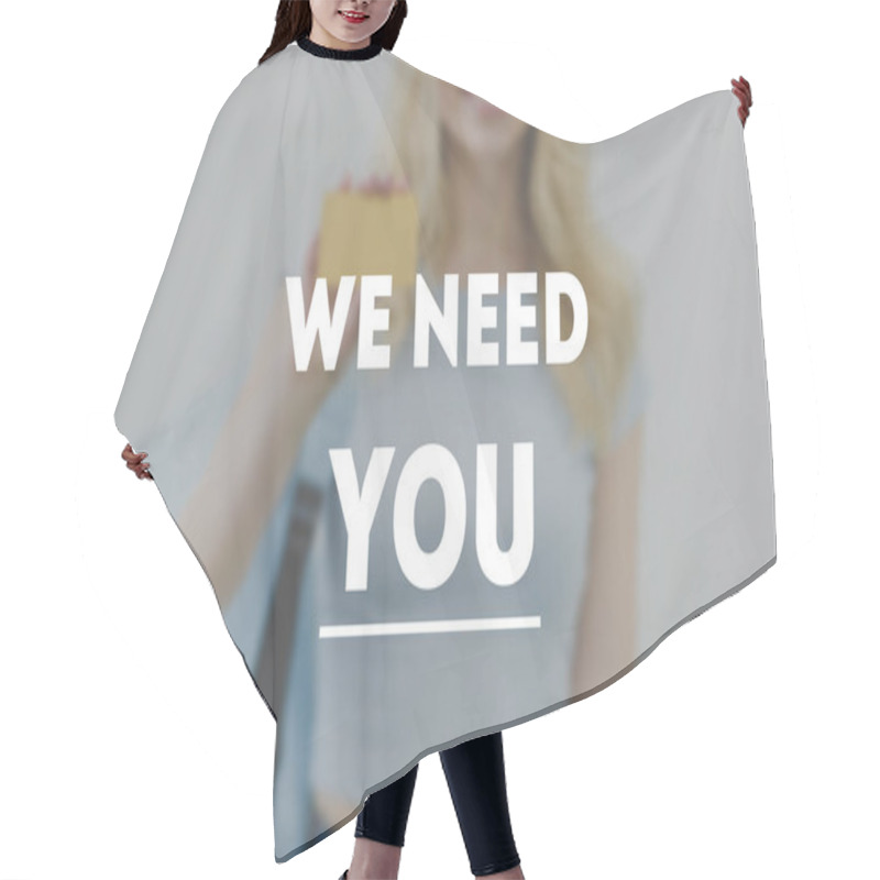 Personality  Cropped Shot Of Young Woman Holding Golden Card, We Need You Inscription Hair Cutting Cape