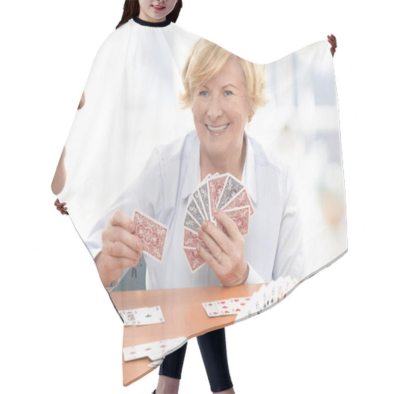 Personality  Senior Couple Playing A Card Game Hair Cutting Cape