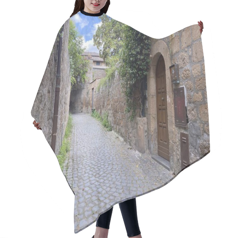 Personality  Charming Cobblestone Alley In Ancient European Town. Stone Walls With Wooden Door And Climbing Plants. Narrow Medieval Street With Rustic Architecture And Atmospheric Lighting. Hair Cutting Cape