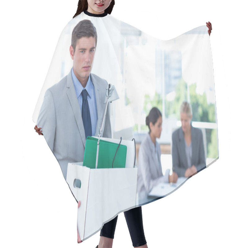 Personality  Businessman carrying his belongings in box hair cutting cape