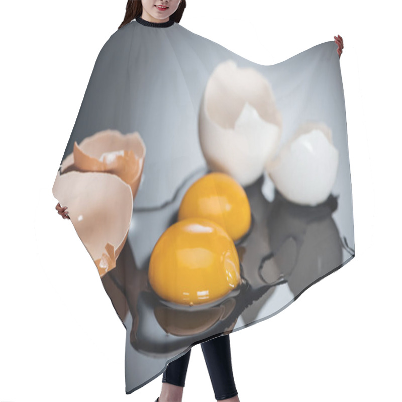 Personality  Selective Focus Of Raw Smashed Chicken Eggs With Yolks, Proteins And Eggshell On Black Background Hair Cutting Cape