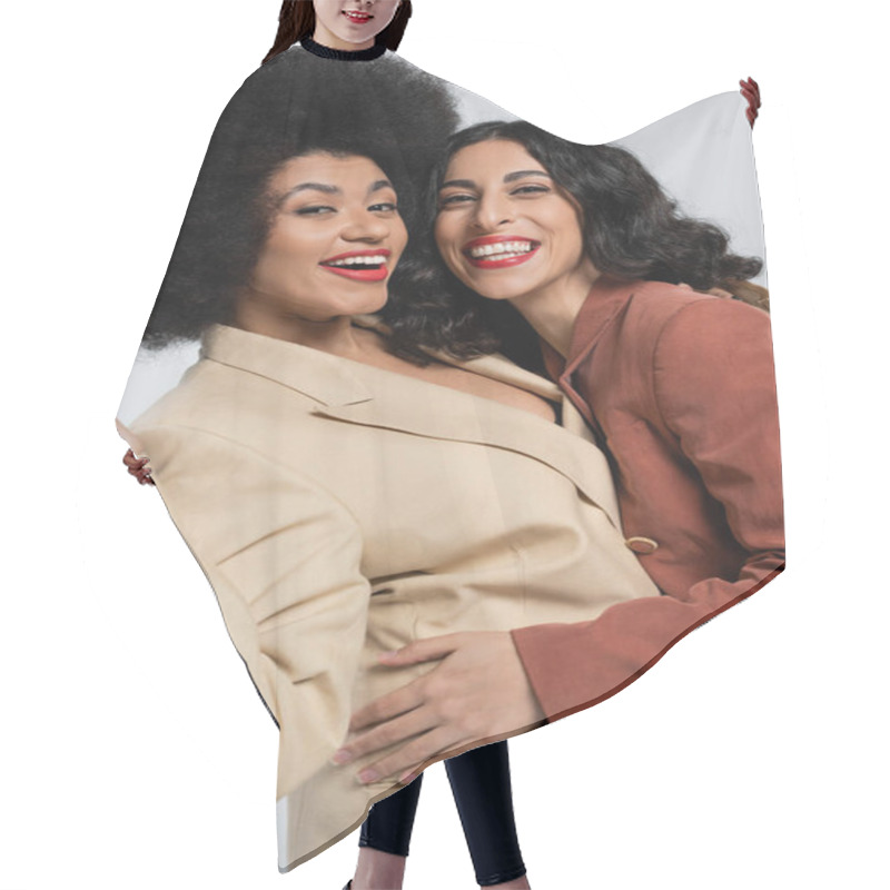 Personality  Happy Multiracial Woman Embracing African American Girlfriend On Grey, Models In Colorful Suits Hair Cutting Cape