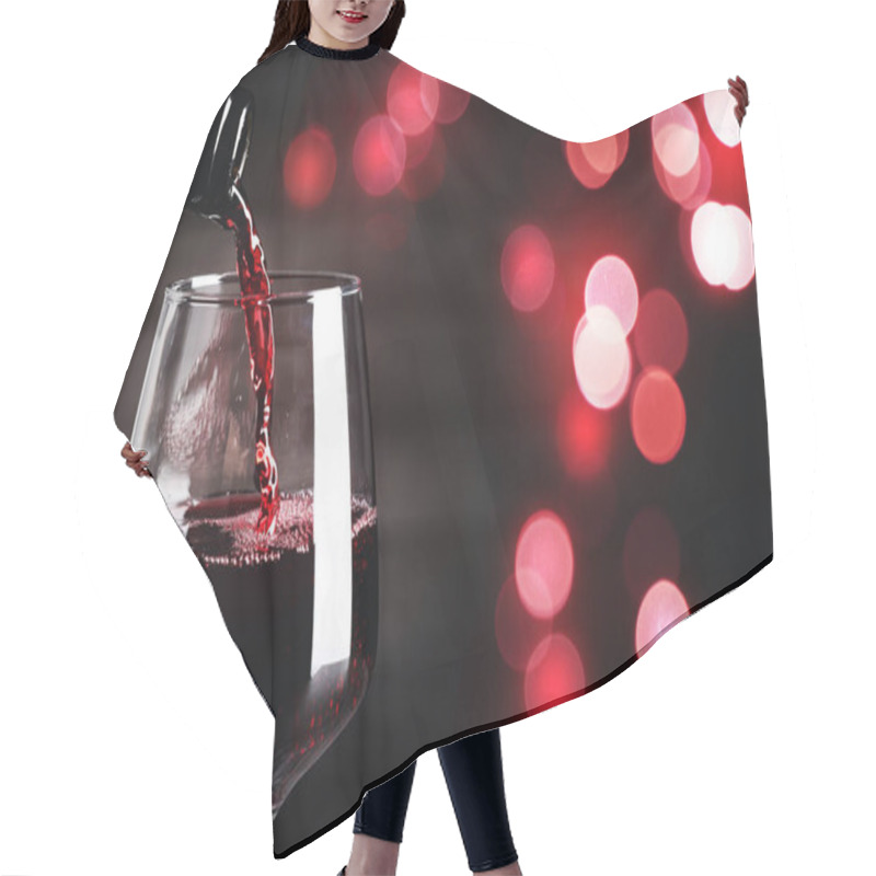 Personality  Pouring Red Wine Into Glass Against Dark Background With Blurred Lights, Closeup. Space For Text Hair Cutting Cape