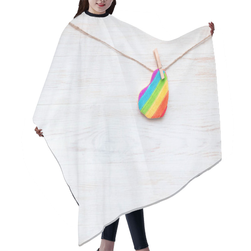 Personality  One Rainbow Heart-shaped Pillow On Clothespin On Wooden Border. Valentines Day Concept. Background For LGBT. Hair Cutting Cape