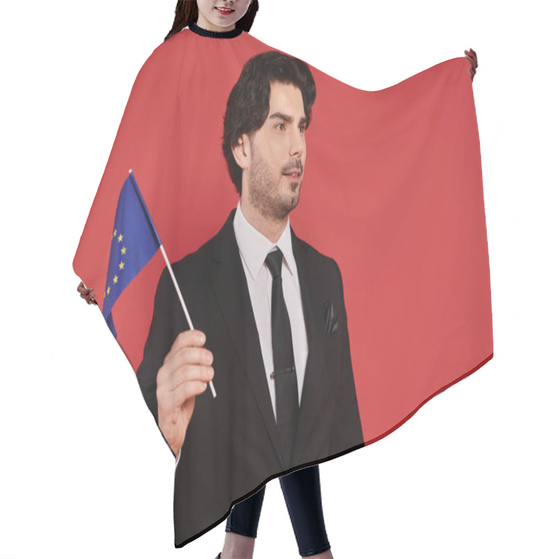 Personality  A Well Dressed Young Man Stands Confidently With A European Flag, Showcasing His Pride And Style. Hair Cutting Cape