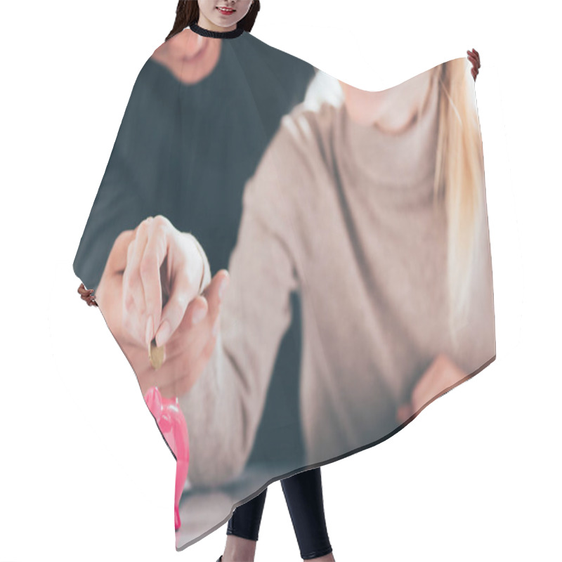 Personality  Cropped Shot Of Happy Couple Putting Coin Into Pink Piggy Bank Hair Cutting Cape