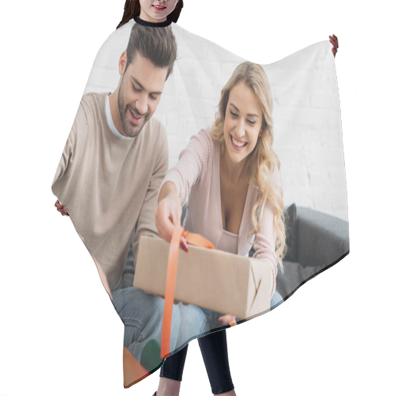 Personality  Smiling Couple Preparing Christmas Gift Box Together At Home Hair Cutting Cape