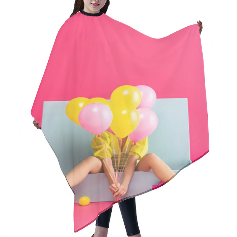 Personality  Young Woman As Doll Holding Balloons And Sitting In Blue Box With Balls And Shopping Bags, On Pink Hair Cutting Cape