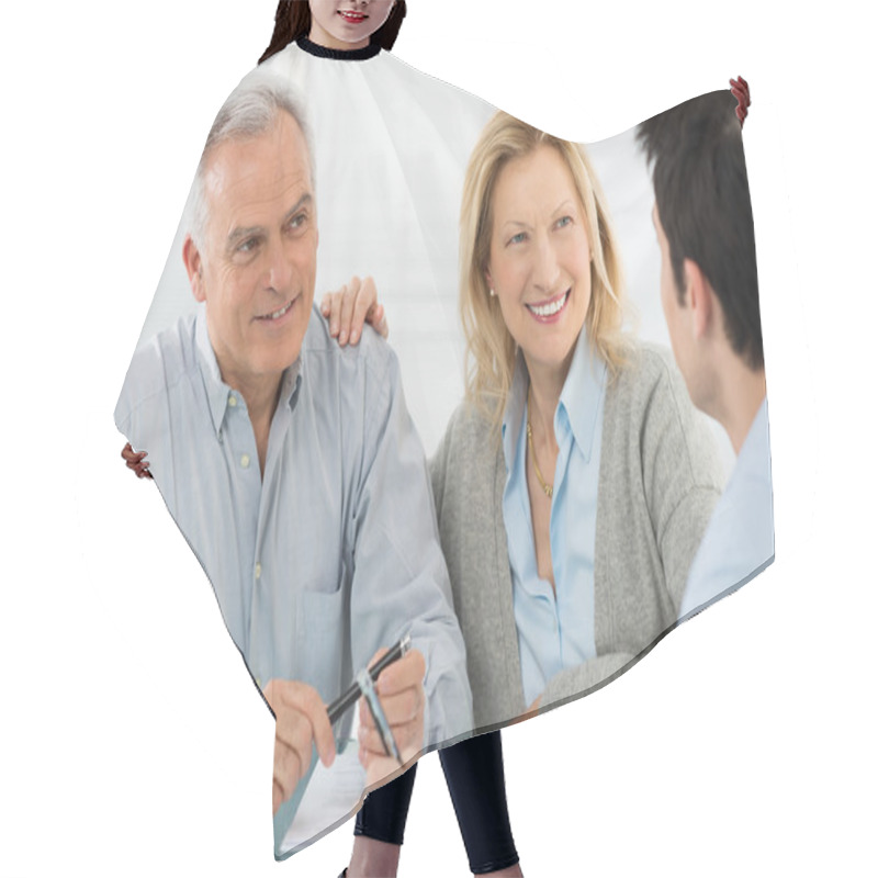 Personality  Senior Couple Talking With A Consultant Hair Cutting Cape