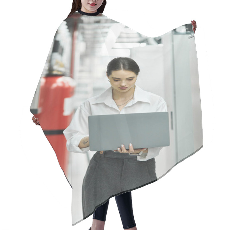 Personality  Focused Woman In A White Shirt Operates A Laptop In A Busy Data Center, Ensuring Smooth Operations. Hair Cutting Cape